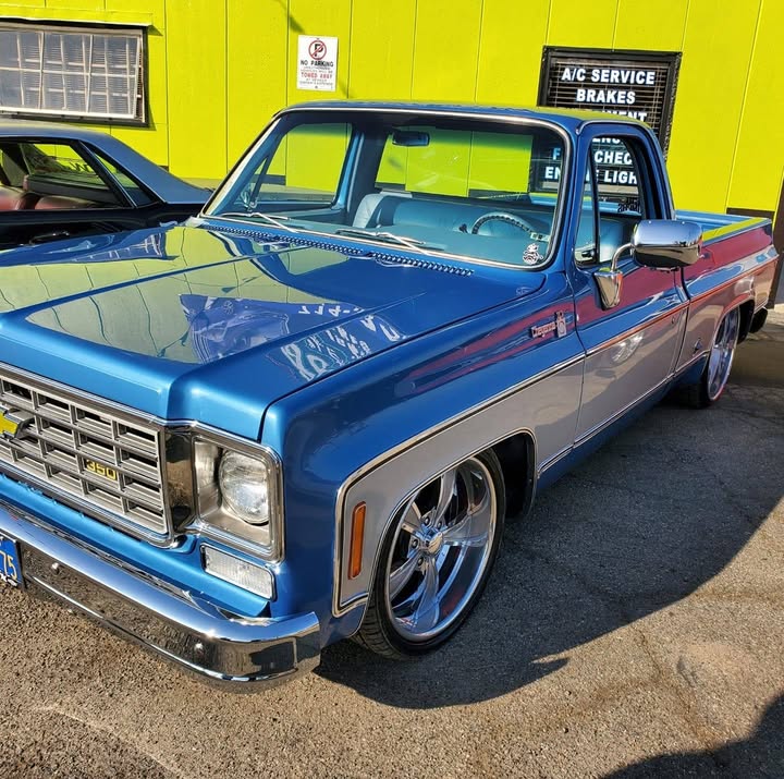 Classic pickup on custom wheels outside Fast Tire Service