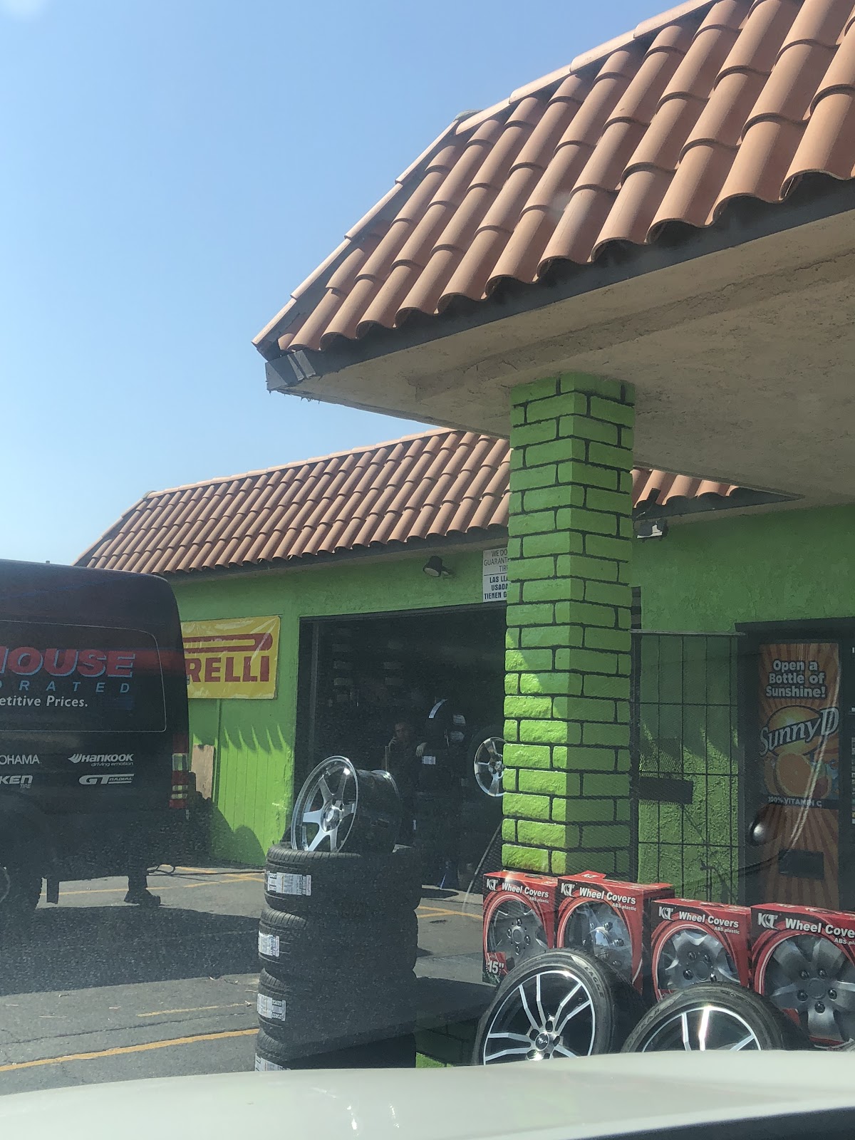 Tires and work bay at Fast Tire Service in Cypress